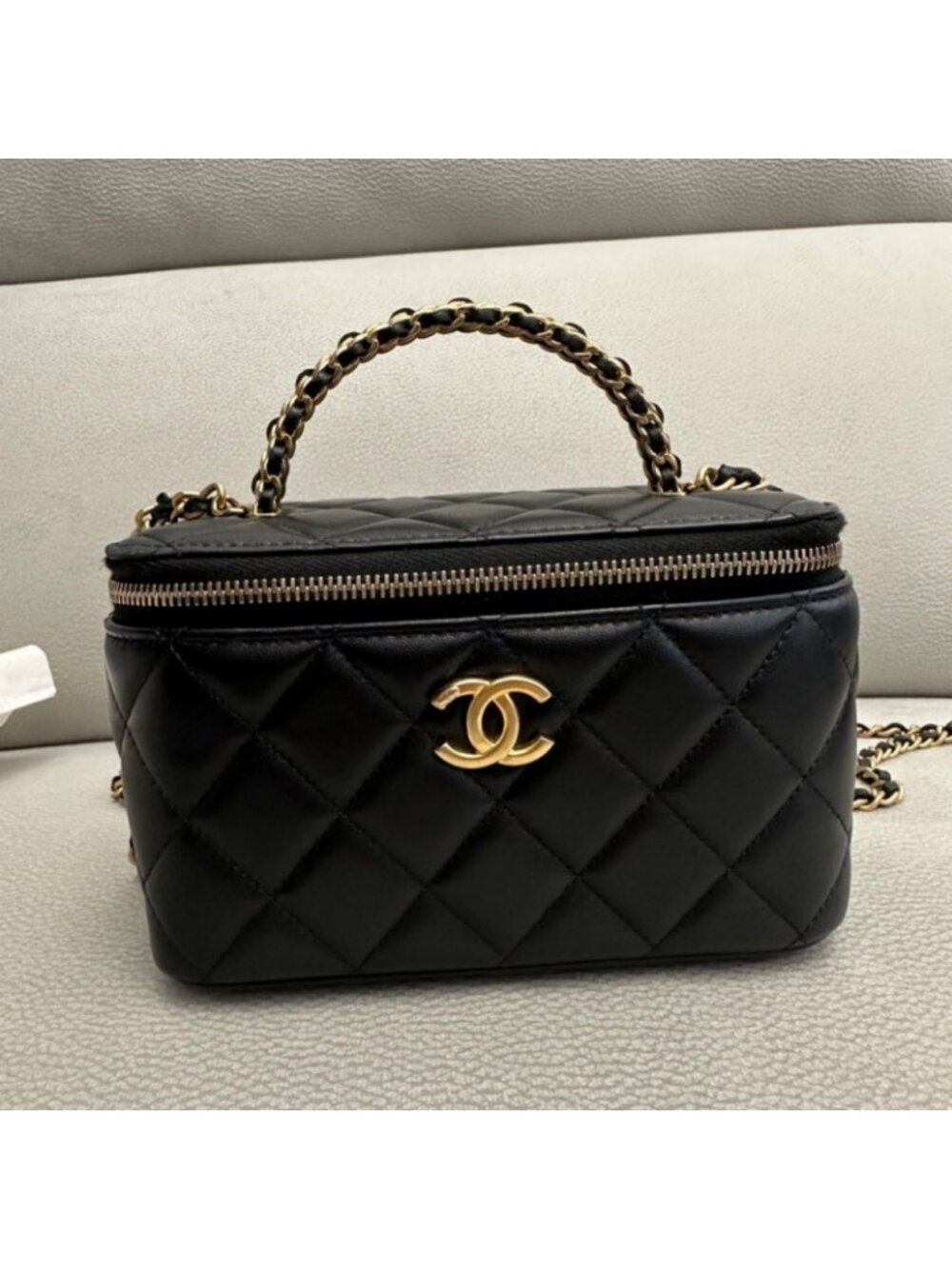 Chanel small black quilted lambskin chain cosmetic bag